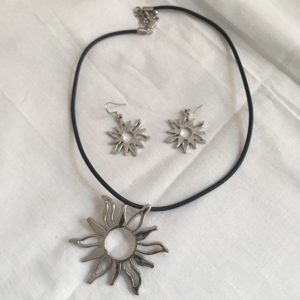Silver tone “Sun” necklace and earrings.